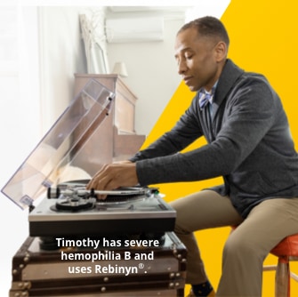 Image of a seated man using a record player.